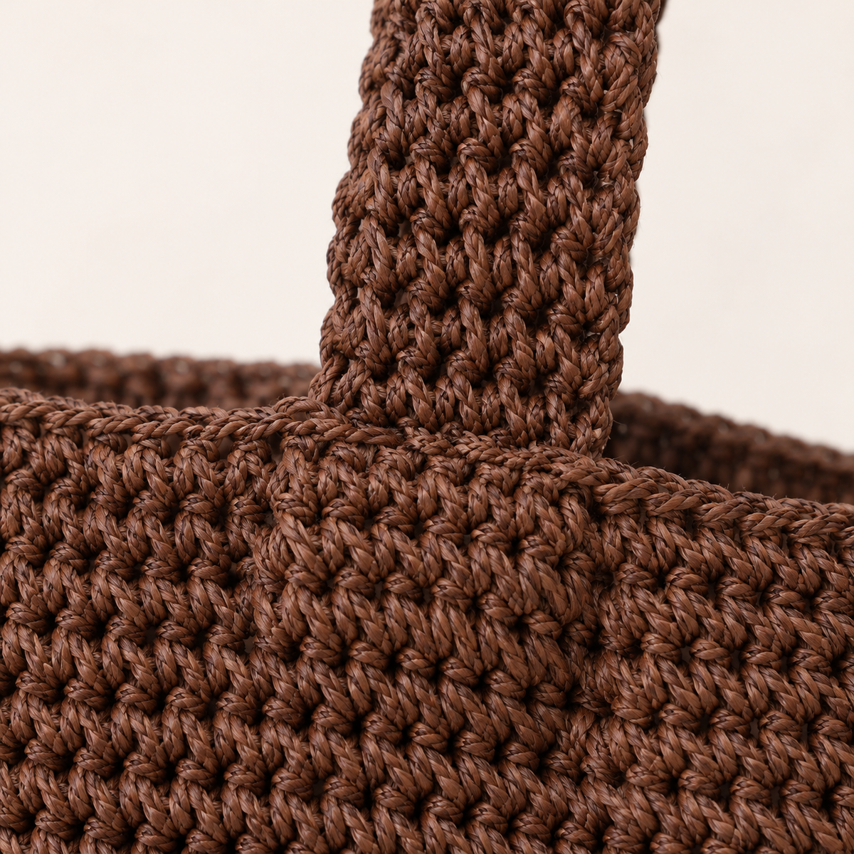 Smiley Woven Shoulder Bag, close-up of the crochet stitches and smiley motif