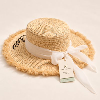 Ribbon Straw Sun Hat in natural straw with a Solace & Straw hangtag