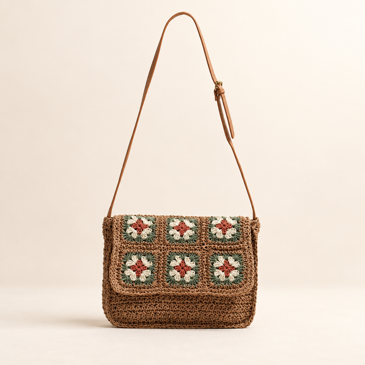 Floral Woven Crossbody in brown, front view with floral crochet squares on the flap