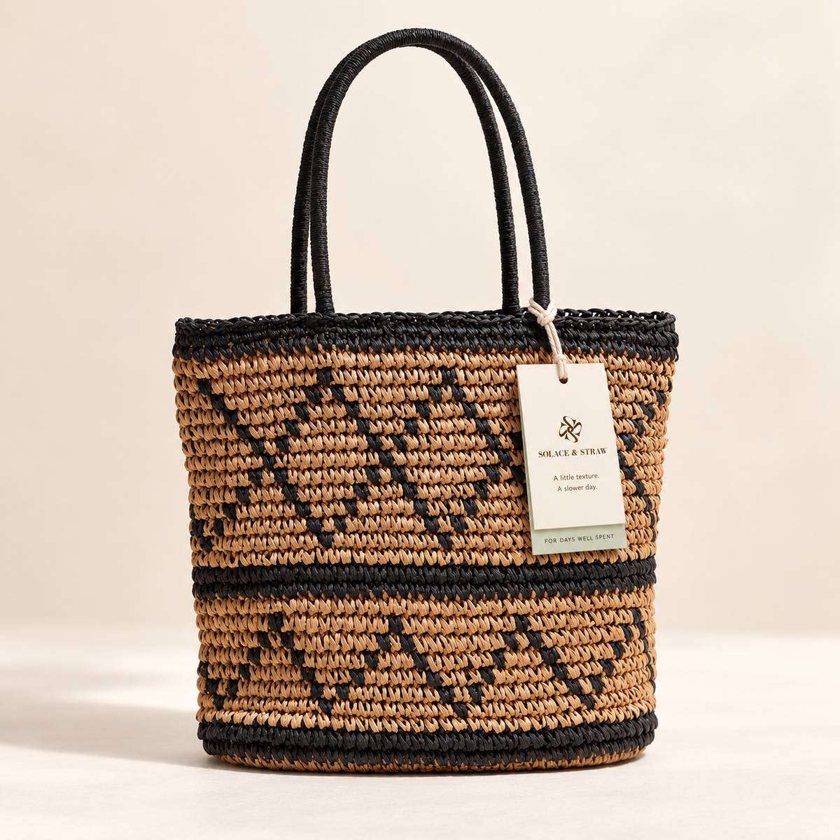 Diamond Weave Shoulder Bag in tan and black with a Solace & Straw hangtag