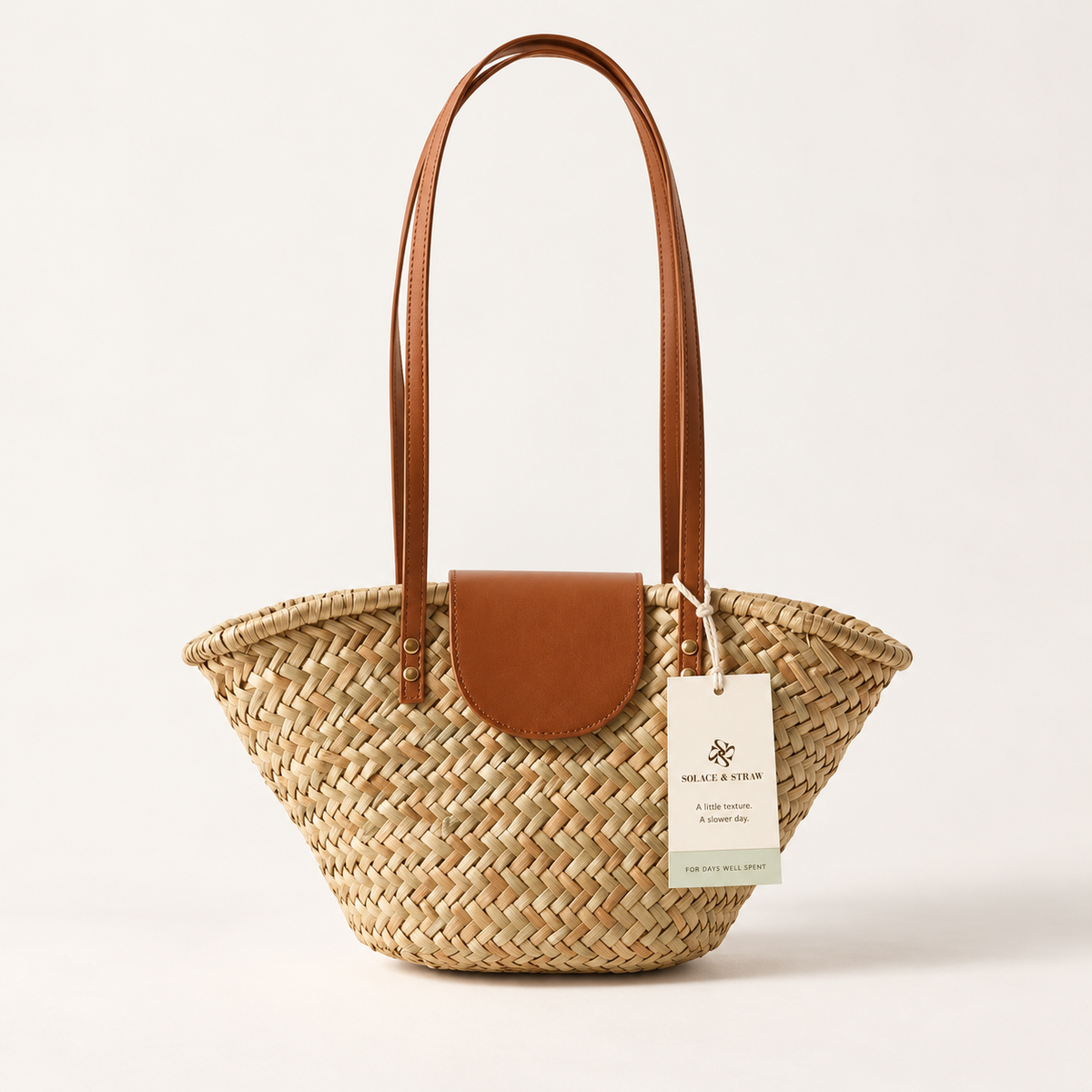 Shell Shape Shoulder Bag in natural tan with a Solace & Straw hangtag