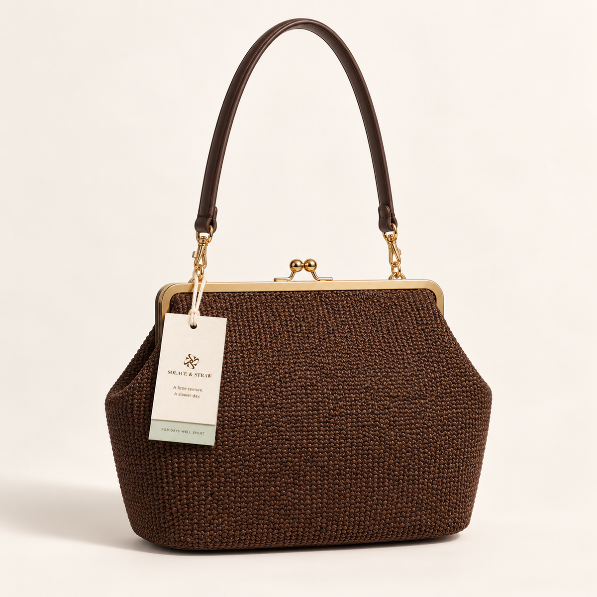 Woven Kiss-Lock Frame Bag, coffee woven, front view with Solace & Straw hangtag