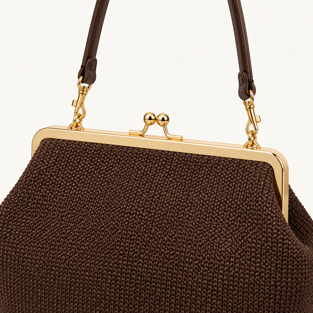 Woven Kiss-Lock Frame Bag, close-up of kiss-lock clasp and gold-tone frame