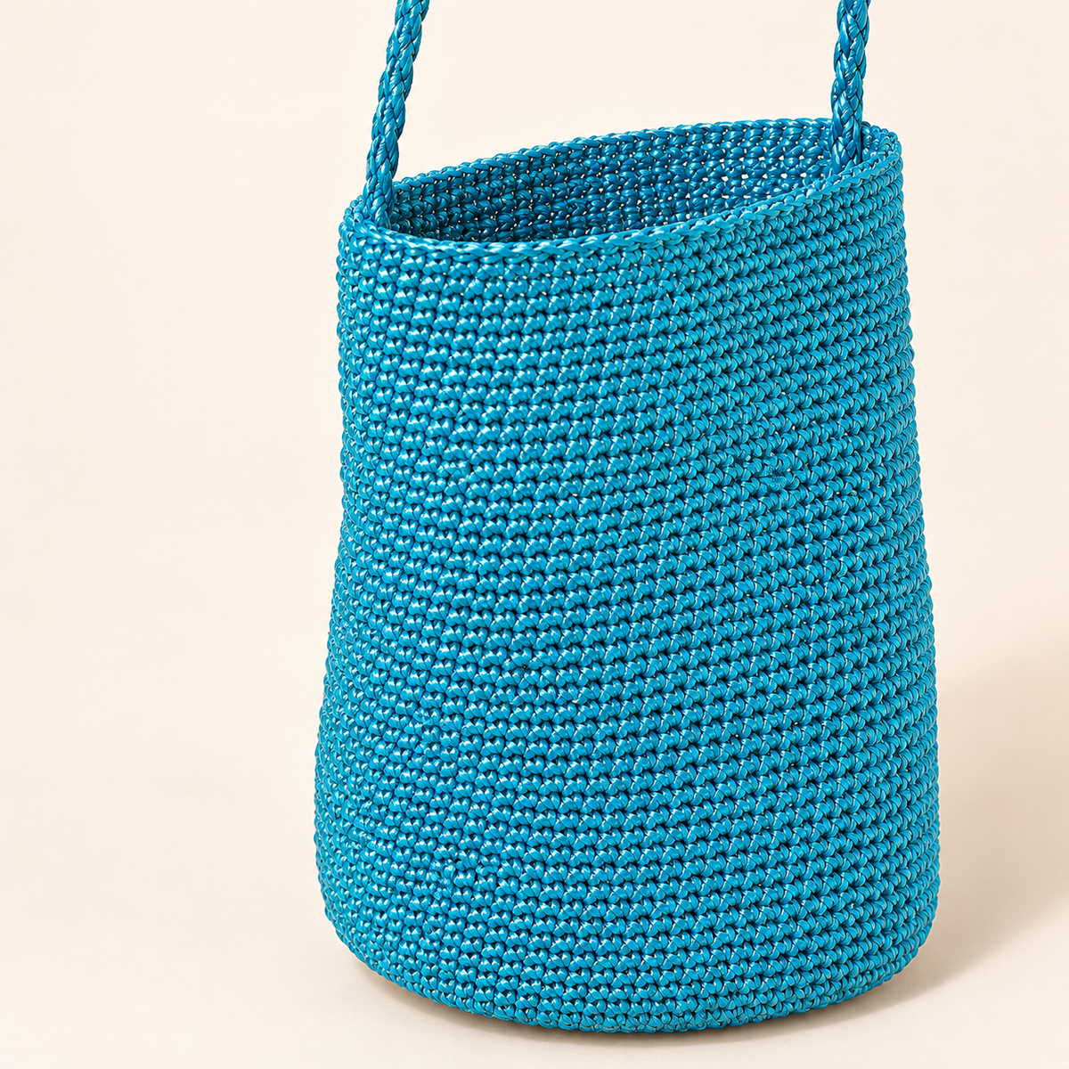 Braided Strap Woven Bucket Bag — Turquoise, close-up of turquoise woven texture and braided strap