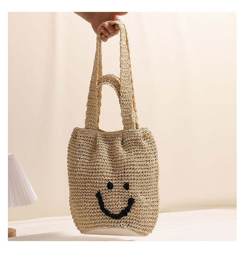 Casual smiley face shoulder cotton thread woven bag new small fresh hand-held commuter straw bag seaside vacation beach bag