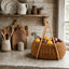 Handwoven rattan picnic basket with lemons and red onions 
on rustic stone farmhouse kitchen counter — Solace & Straw