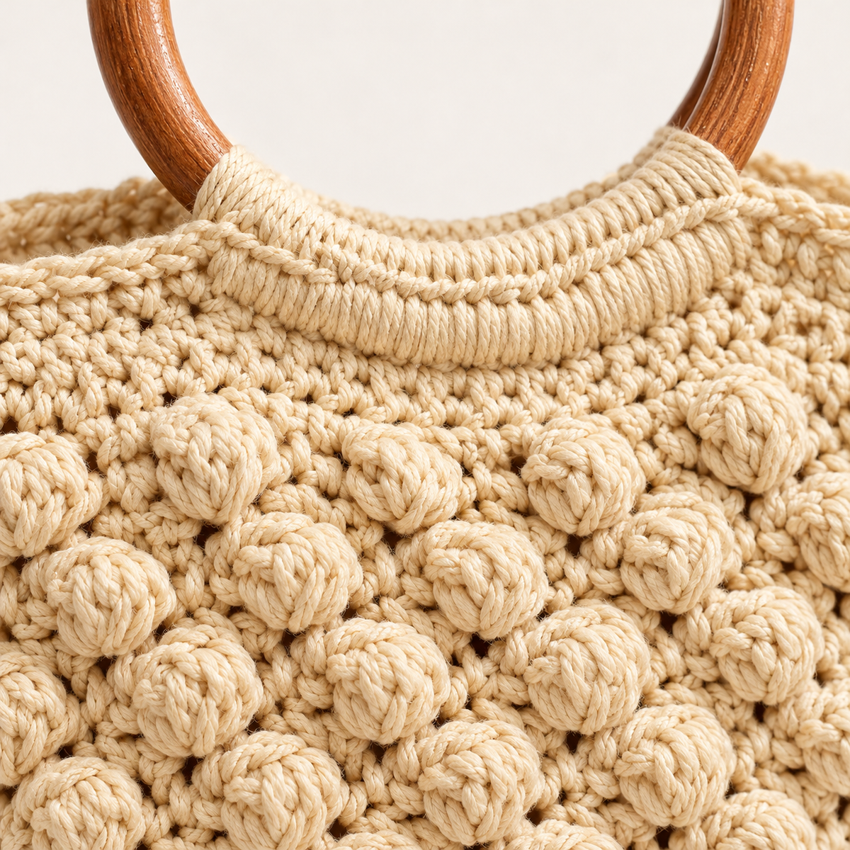 Wooden Handle Woven Bag, close-up of the cotton bobble weave and wrapped handle join