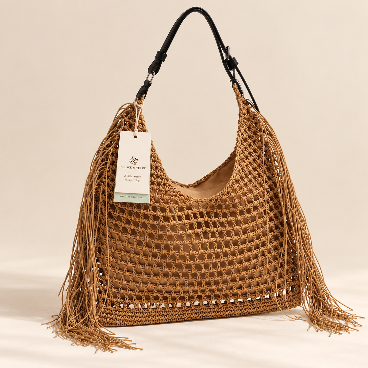 Tassel Woven Tote in brown with a Solace & Straw hangtag