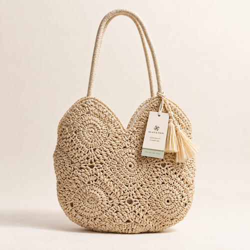 Hollow Weave Tassel Bag in cream with a Solace & Straw hangtag