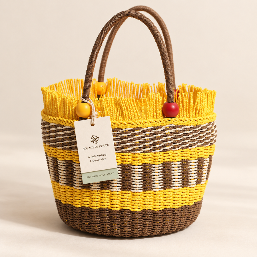 Wooden Bead Bucket Bag in tan with yellow accents with a Solace & Straw hangtag