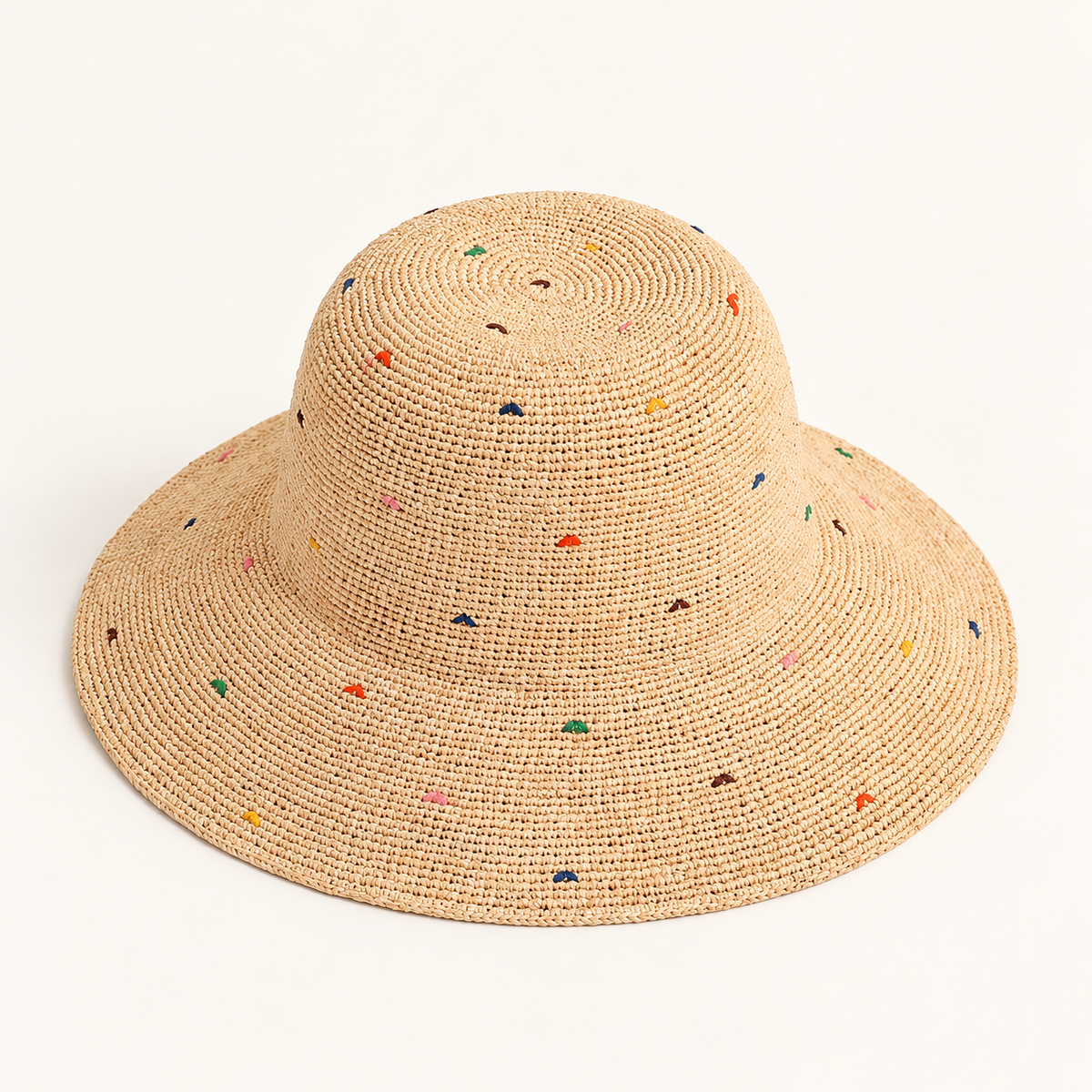 Color Dot Sun Hat in natural straw, front view with a wavy brim and small multicoloured dots