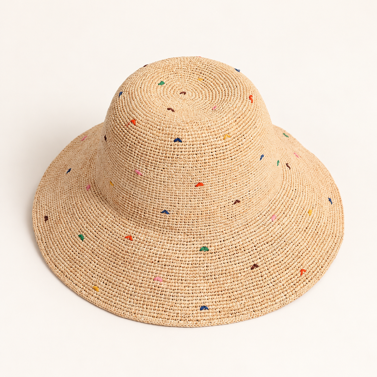 Color Dot Sun Hat, angled view showing a wavy brim and small multicoloured dots