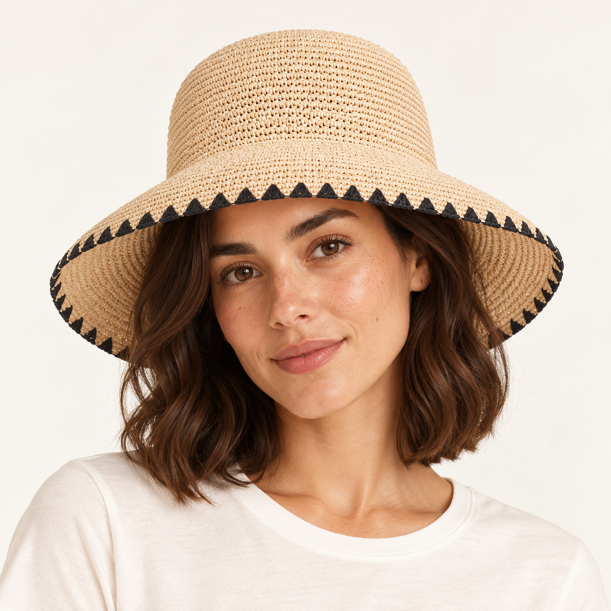 Woman wearing the Black Trim Straw Hat with a black ribbon and black brim binding