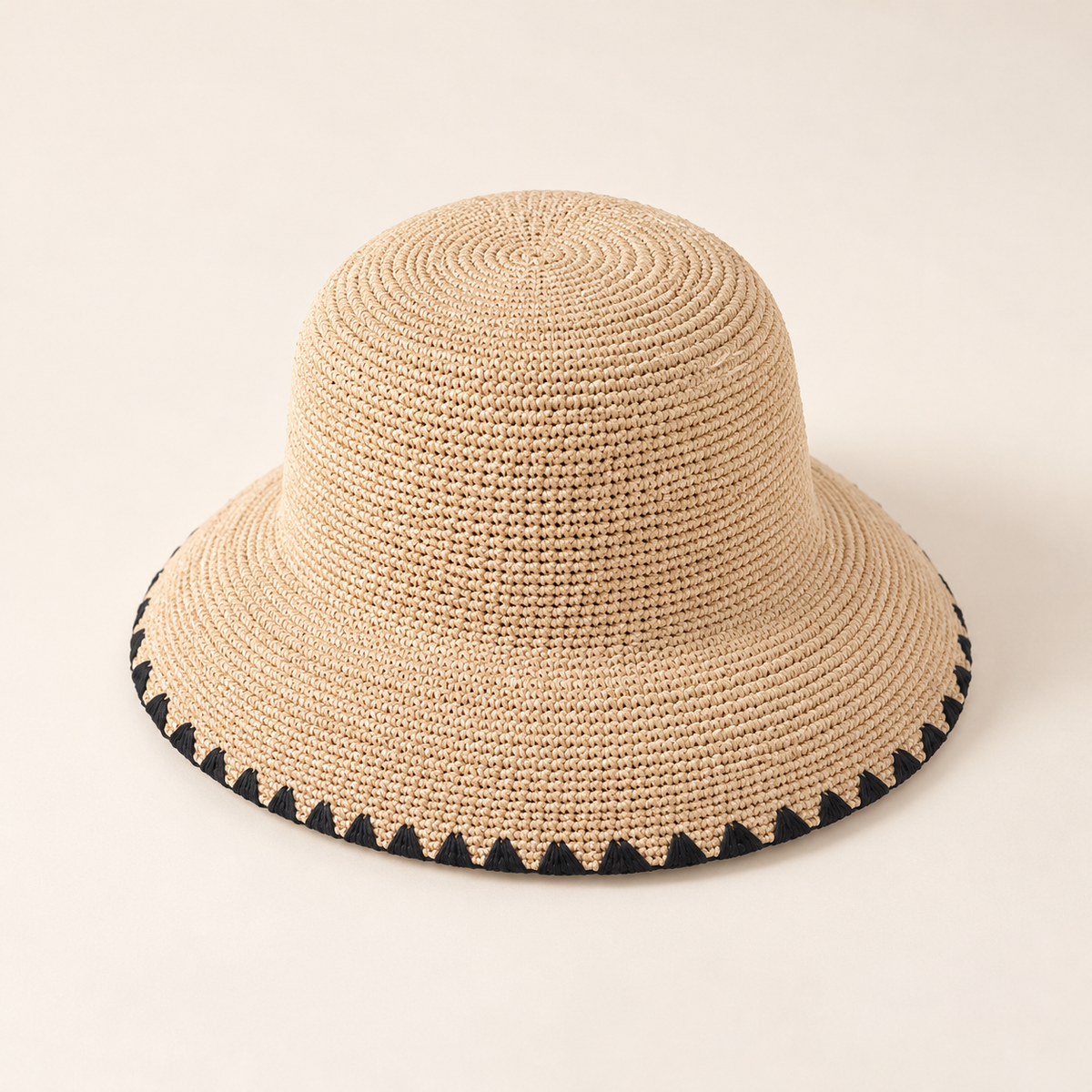 Black Trim Straw Hat, angled view showing a black ribbon and black brim binding