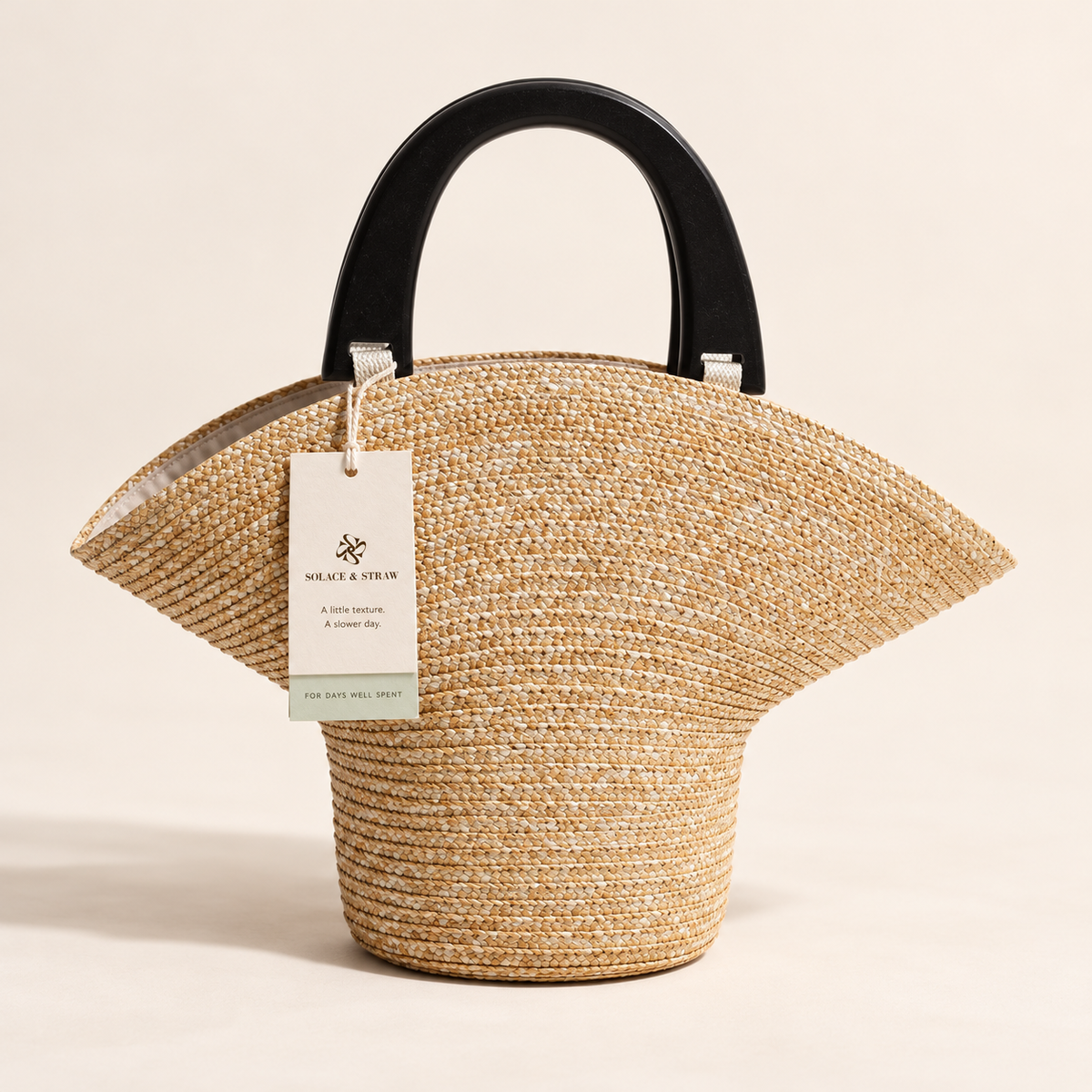 Wood Handle Barrel Bag in natural straw with a Solace & Straw hangtag