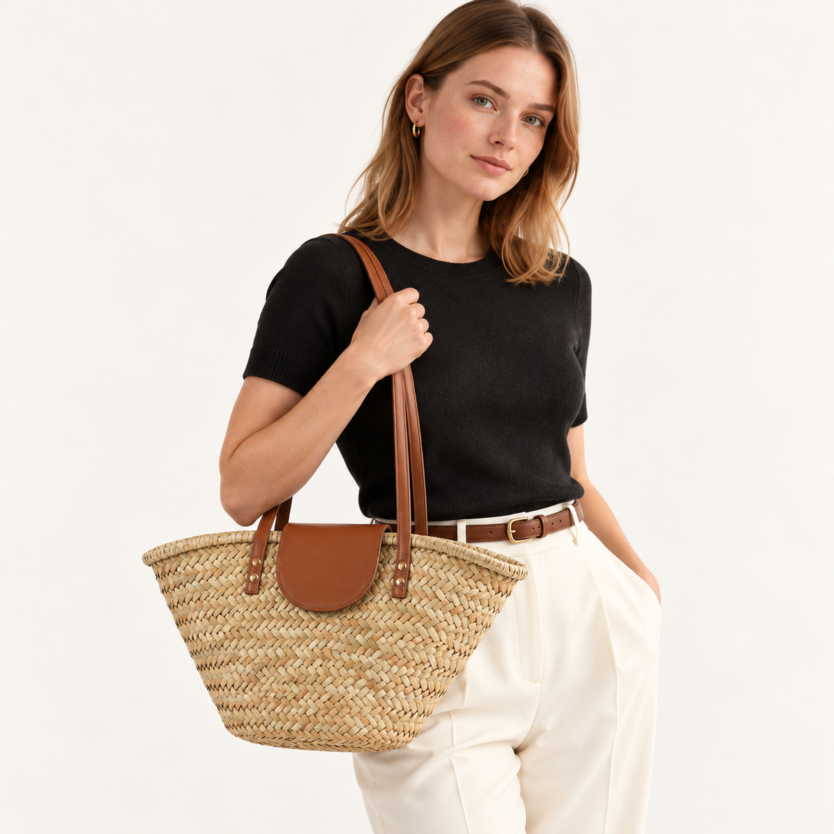 Woman carrying the Shell Shape Shoulder Bag with brown handles and a matching flap