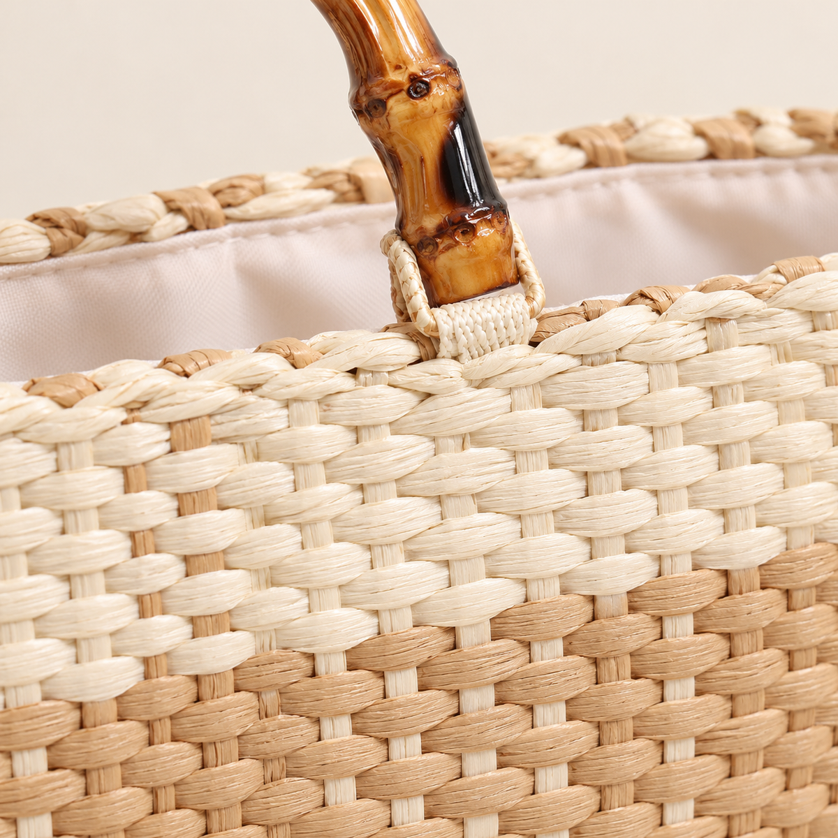 Grid Woven Tote, close-up of the checker weave and handle attachment