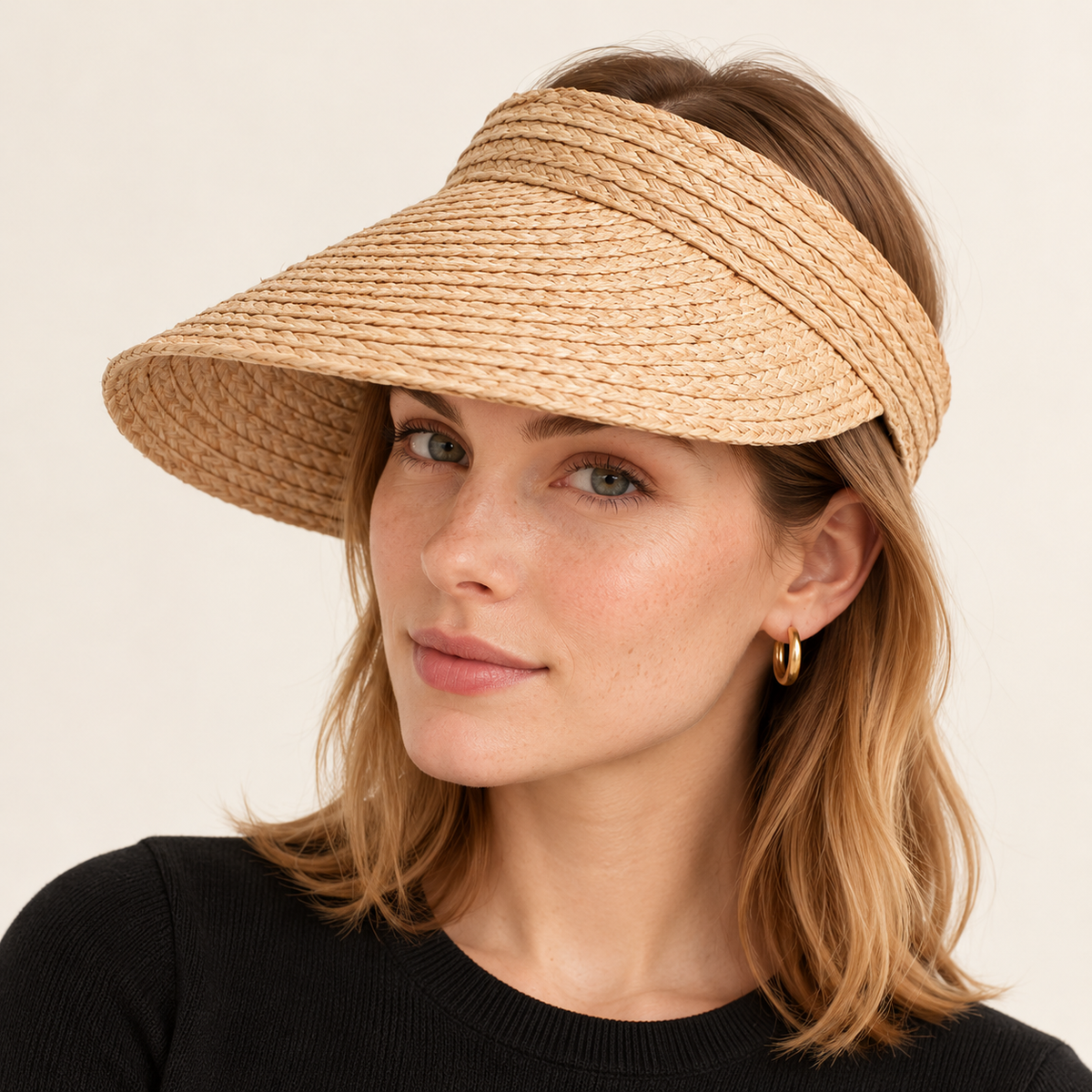 Woman wearing the Open Top Straw Visor with an open top and curved brim