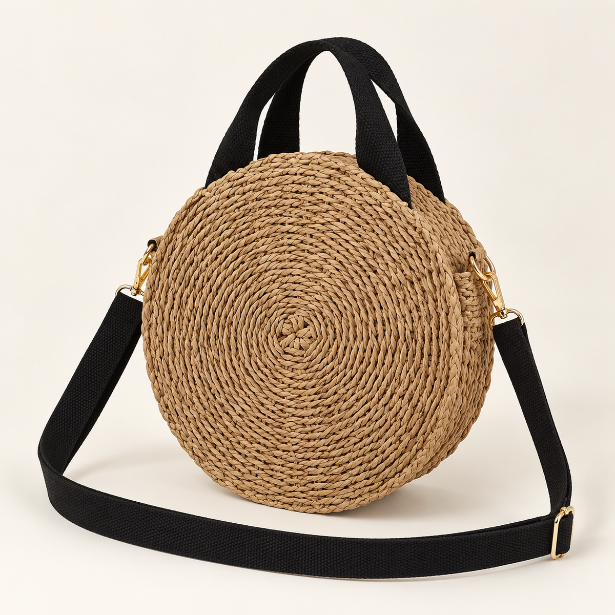 Round Woven Crossbody, angled view showing a round coiled body and black straps