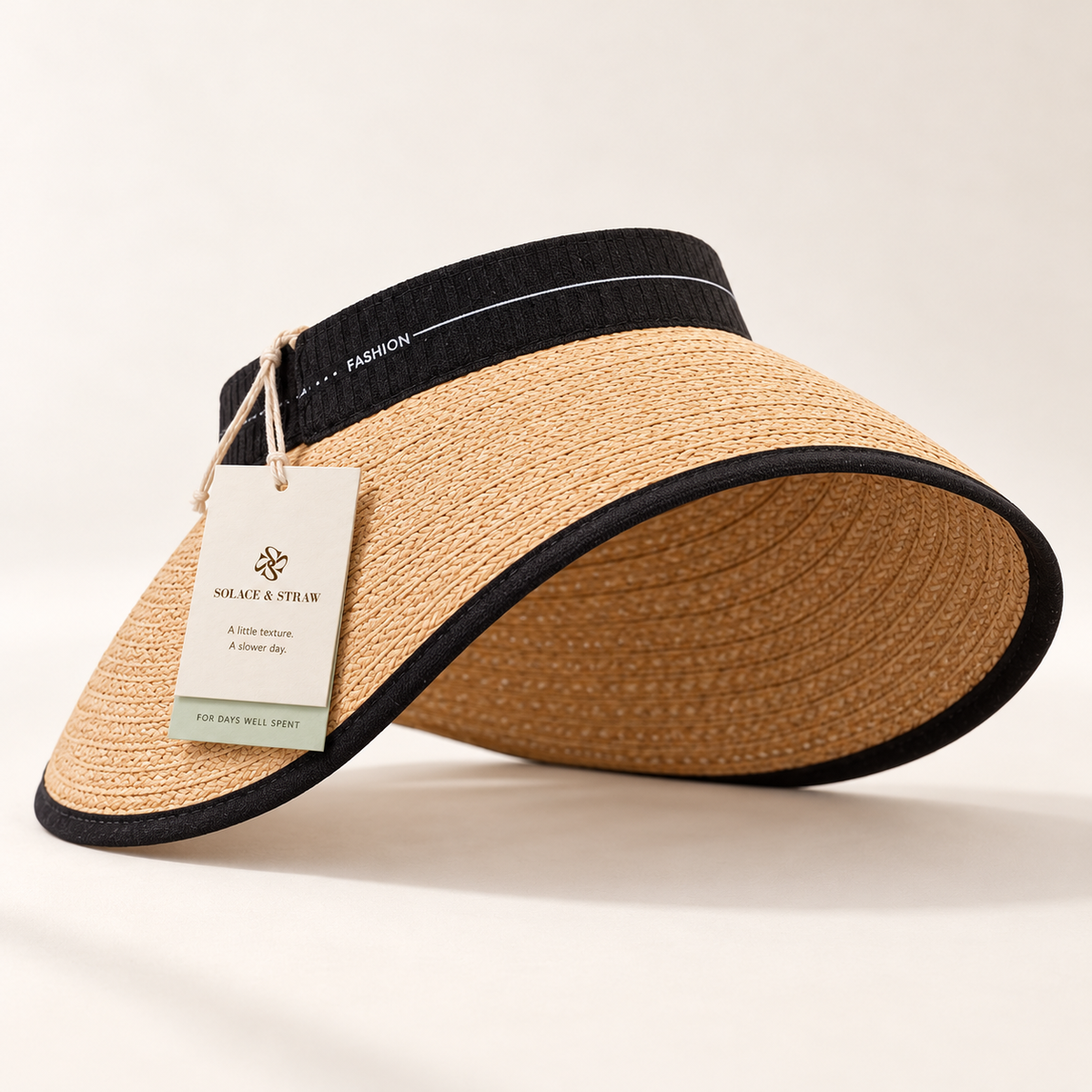 Wide Brim Straw Visor in natural tan with a Solace & Straw hangtag