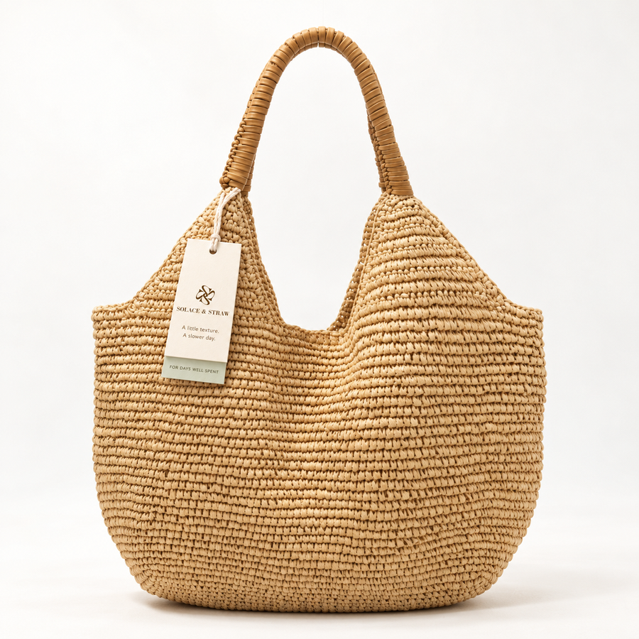 Everyday Paper Woven Shopper in light brown, front view with Solace & Straw hangtag