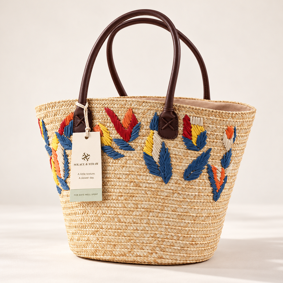 Leaf Embroidered Wheat Straw Tote in natural / multicolor leaves, front view with Solace & Straw hangtag