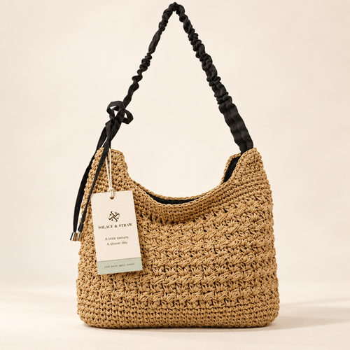 Bow Strap Woven Hobo in tan / black strap, front view with Solace & Straw hangtag