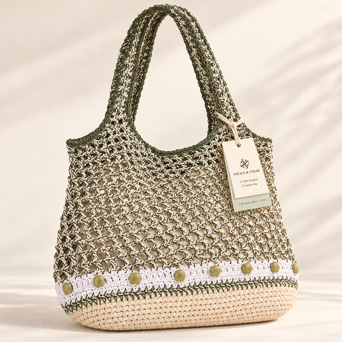 Beaded Stripe Openwork Tote in green / cream / no charm, front view with Solace & Straw hangtag