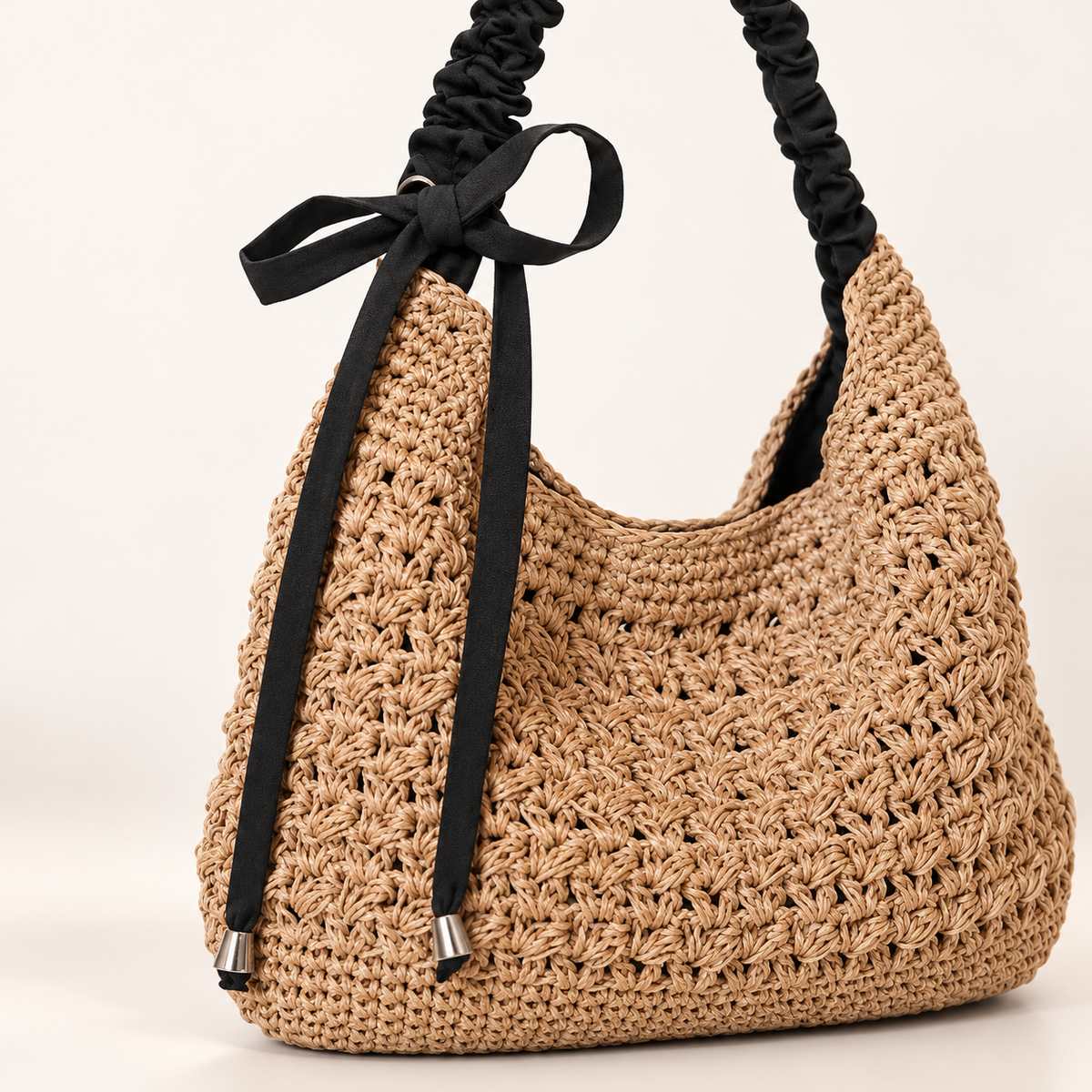 Bow Detail Woven Shoulder Bag, close-up of gathered black strap and bow connection