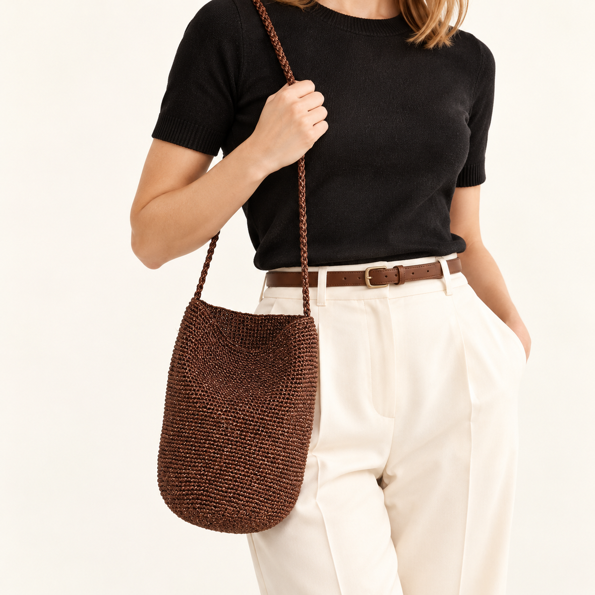 Woman carrying the Braided Strap Woven Bucket Bag — Brown in brown