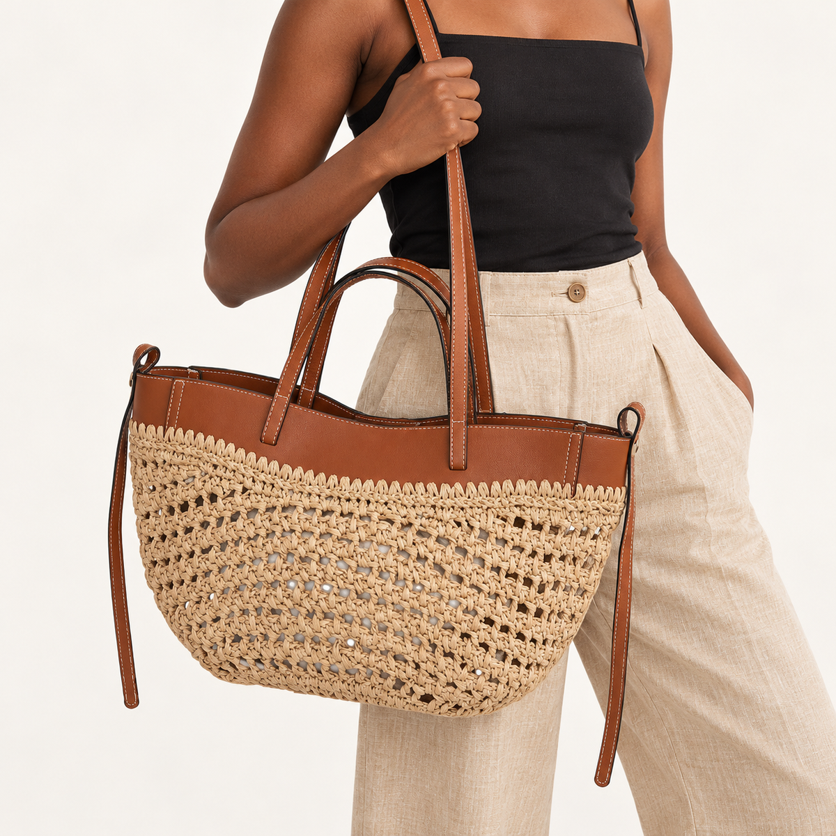 Woman carrying the Double Handle Woven Tote in natural / brown trim