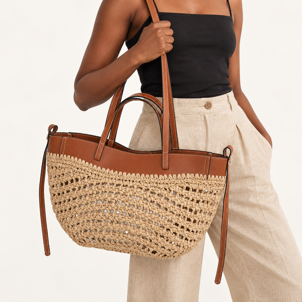 Woman carrying the Double Handle Woven Tote in natural / brown trim