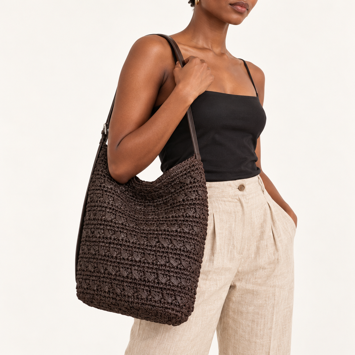 Woman carrying the Textured Woven Shoulder Bag in dark coffee