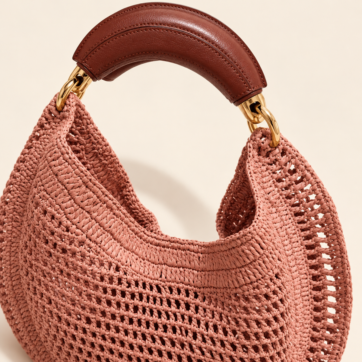 Crescent Woven Top Handle Bag, close-up of curved handle attachment and open weave